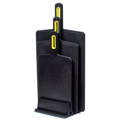 Practic cutting board set, featuring three sizes, ensures versatility for food prep tasks. Crafted in sleek black Vegana, these boards are both durable and stylish, ideal for any kitchen.